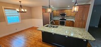 Building Photo - Welcome to this stunning 4 bedroom, 3 bath...