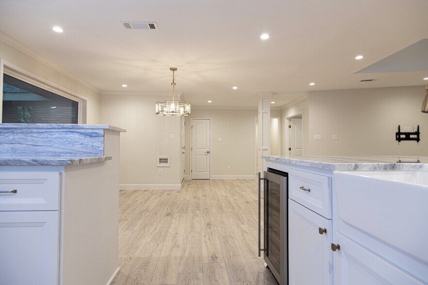 Dining room from kitchen with wine fridge - 3619 Braeswood S Blvd