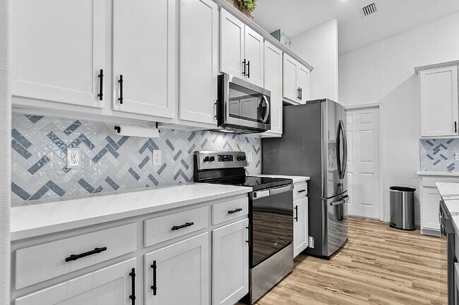 Building Photo - Modern 4-Bedroom, 3-Bath Home with Private In-Law Suite – Palm Coast, FL