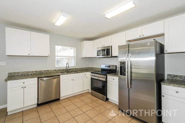 Building Photo - Newly Renovated Single Family Home | 4 BR/2BA | Partially fenced  front yard