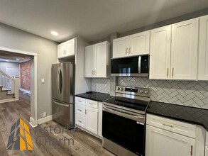 Building Photo - 2 Bedroom Home with Den, Exposed Brick, and Updated Kitchen in Brooklyn Park