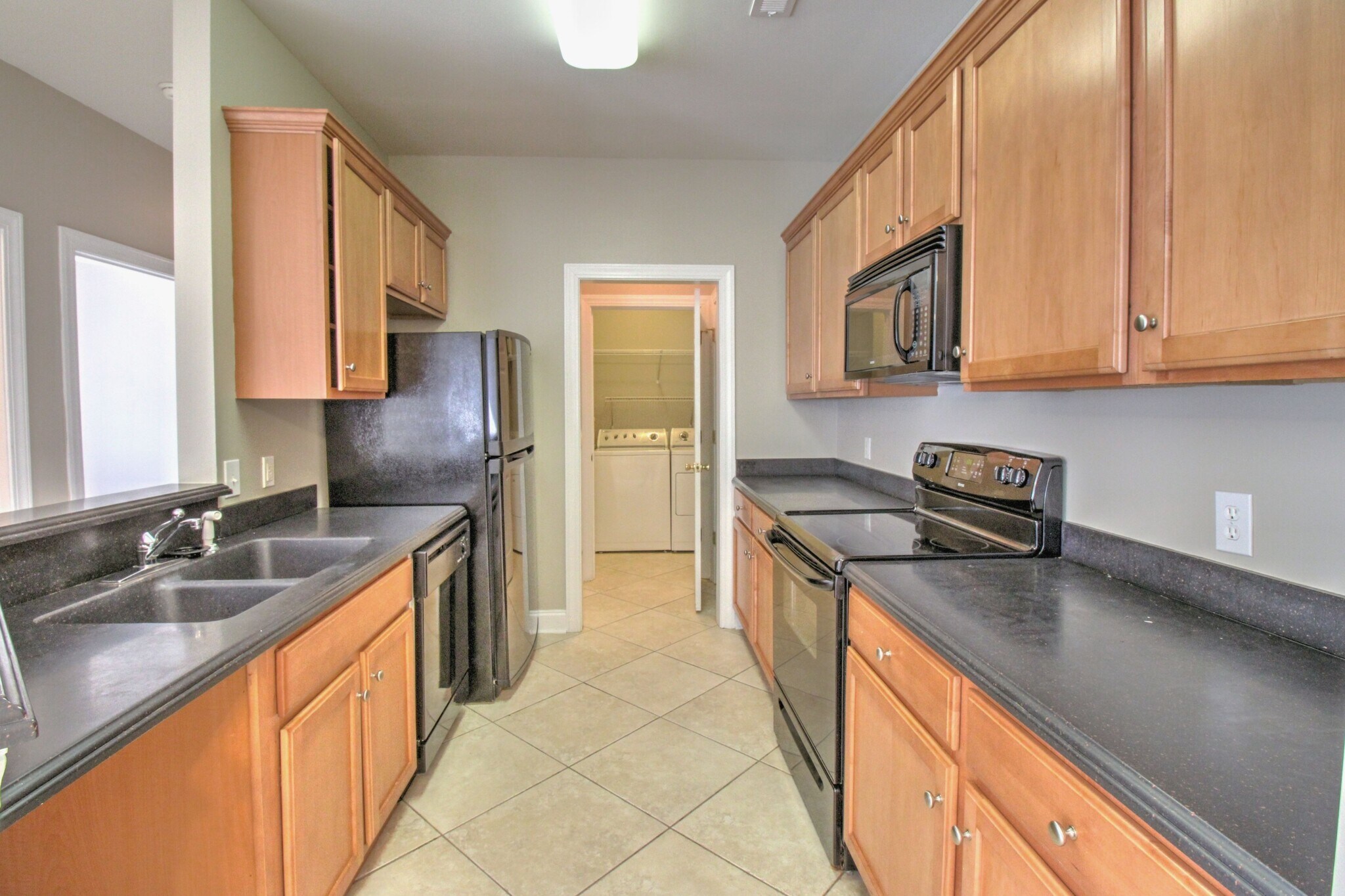 Solid surface counter tops, dishwasher, smooth top stove, microwave and refrigerator. (Washer/Dryer in laundry room are convenience items and will not be replaced or repaired) - 2077 Silvercrest Dr