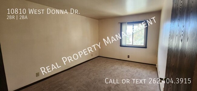 Building Photo - Two Bedroom Upper Condo w/ Utilities Included