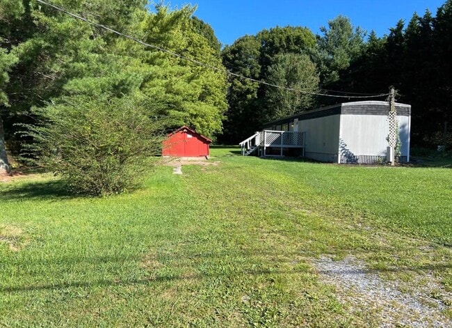 Building Photo - 2 bedroom 2 bath mobile home for rent on half acre!
