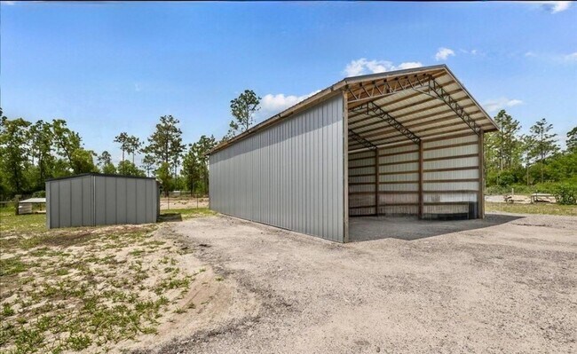 Building Photo - Gated 10-Acre Luxury Retreat with 40x60 Climate-Controlled Shop & Barn!