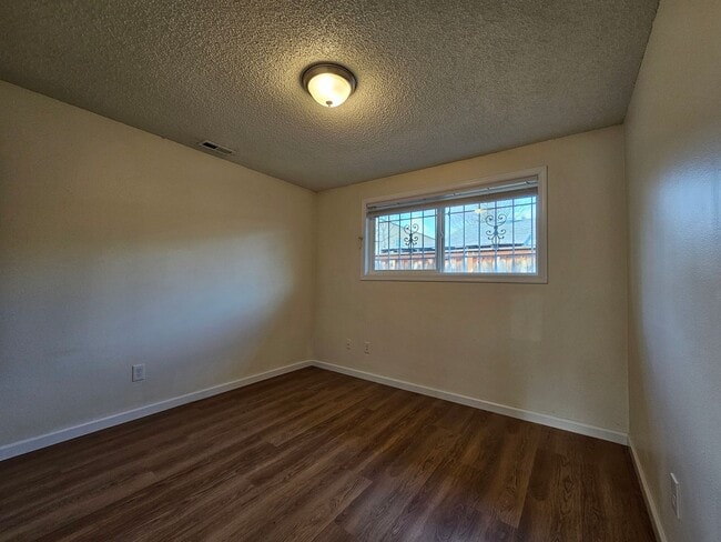 Building Photo - Charming Single-Level Home Featuring New Hardwood Floors, Bright Bedrooms & Open-Concept Living