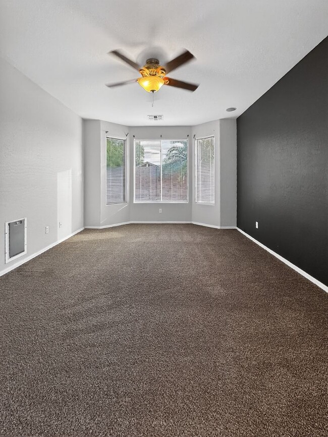 Building Photo - Single-level 4 bed, 2 bath home with tandem 3-car garage and RV gate.
