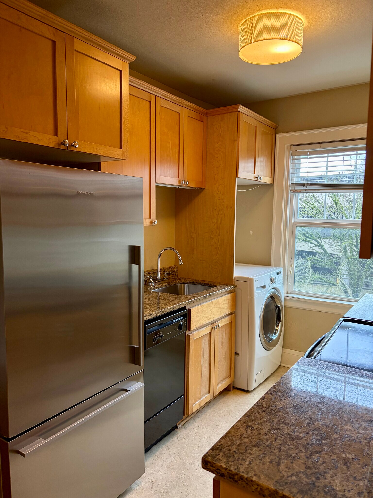 Dishwasher and washer/dryer combo - plenty of room for a microwave - 1509 NE 10th Ave
