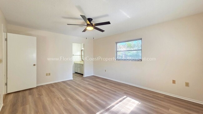Building Photo - SPACIOUS SARASOTA HOME WITH LARGE FENCED YARD! MOVE IN READY! ALL TILE/ NEW LVP!