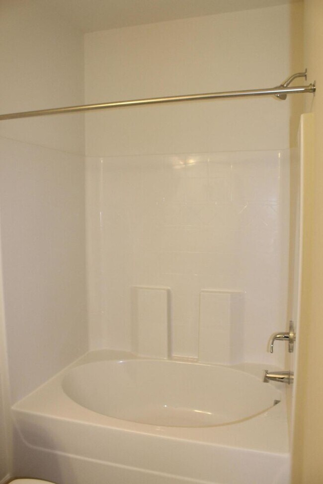 Building Photo - Sun-Filled 3-Story End-Unit Townhome with Fenced Yard, Storage & Resort-Style Pool