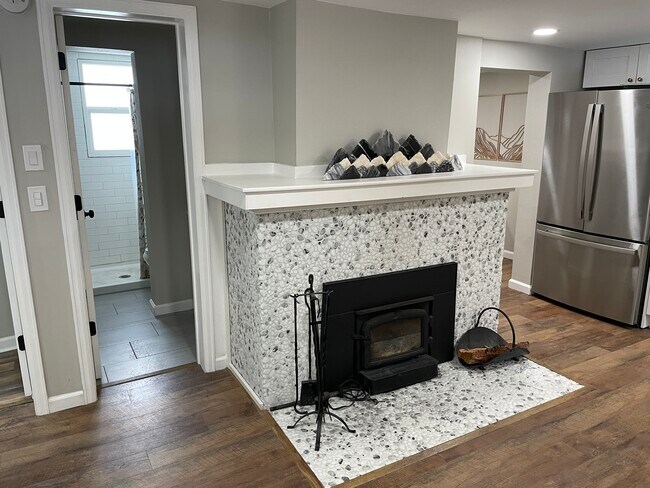 Wood-burning stove with bathroom to the left - 8255 Oak St