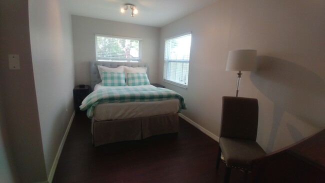 Third bedroom. queen bed - 47 Sea Island Dr N