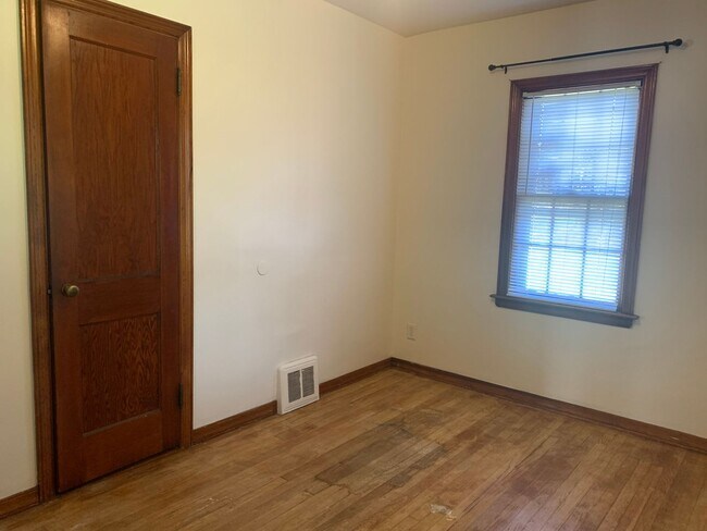 Building Photo - Three bedroom home with beautiful hardwood floors and central air!