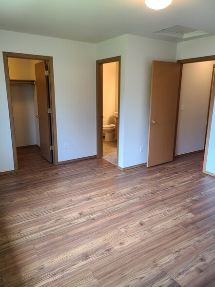 Primary Bedroom upstairs looking at entrance, closet and bathroom doors - 246 163rd St S