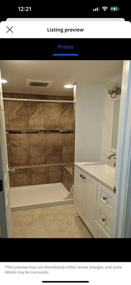 Downstairs walk in shower with a bench. - 501 W Grandview Ave