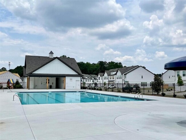 Building Photo - Stylish 3BR Townhome with Private Yard & T...