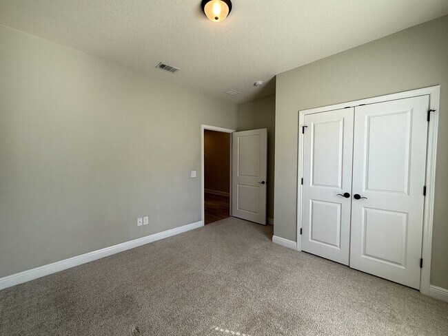 Building Photo - Spacious 3 Bedroom 2 Bath + Office with Split Floor Plan & Screened Patio in Pace!