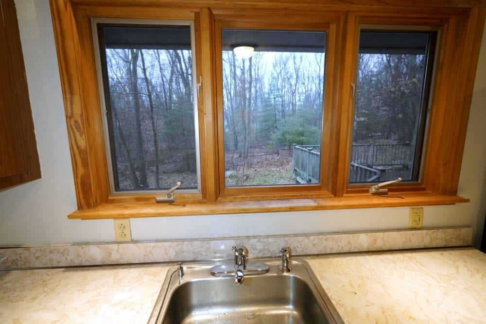 View of private woods from the kitchen sink - 208 Grove St