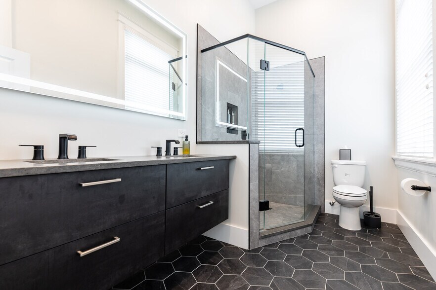 Spa like bath with double sinks, German floating cabinets, quartz and in mirror lighting. - 795 E McMillan St