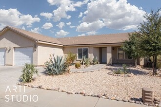Building Photo - 3-bedroom 2-bathroom townhouse with a 1-ca...