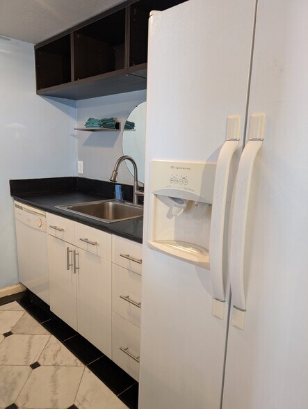 Sink with disposal and double door fridge with ice maker - 2228 Sandpiper St