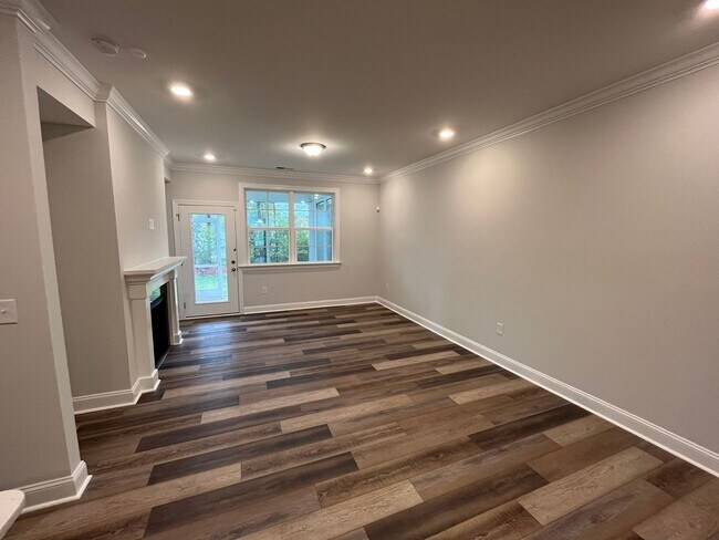 Building Photo - Newly Built 4BD, 3BA Cary Townhome with Modern Amenities and Screened-In Patio
