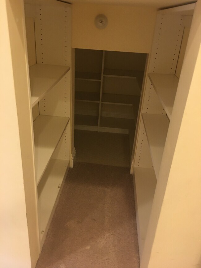 Upstairs bedroom with deep cabinet storage - 1540 S Bentley Ave