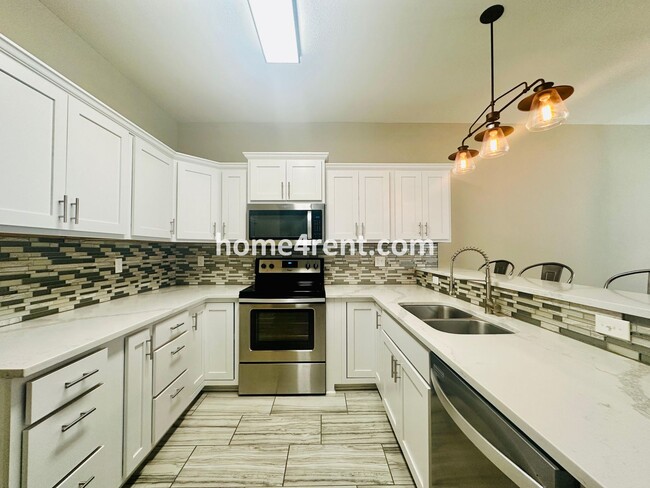 Building Photo - Ranch Style Home w/ Updated Kitchen, including SS Appliances and Granite Counters Plus a Large Un...