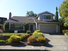 Building Photo - SPACIOUS FOUR BEDROOM / THREE AND HALF BAT...