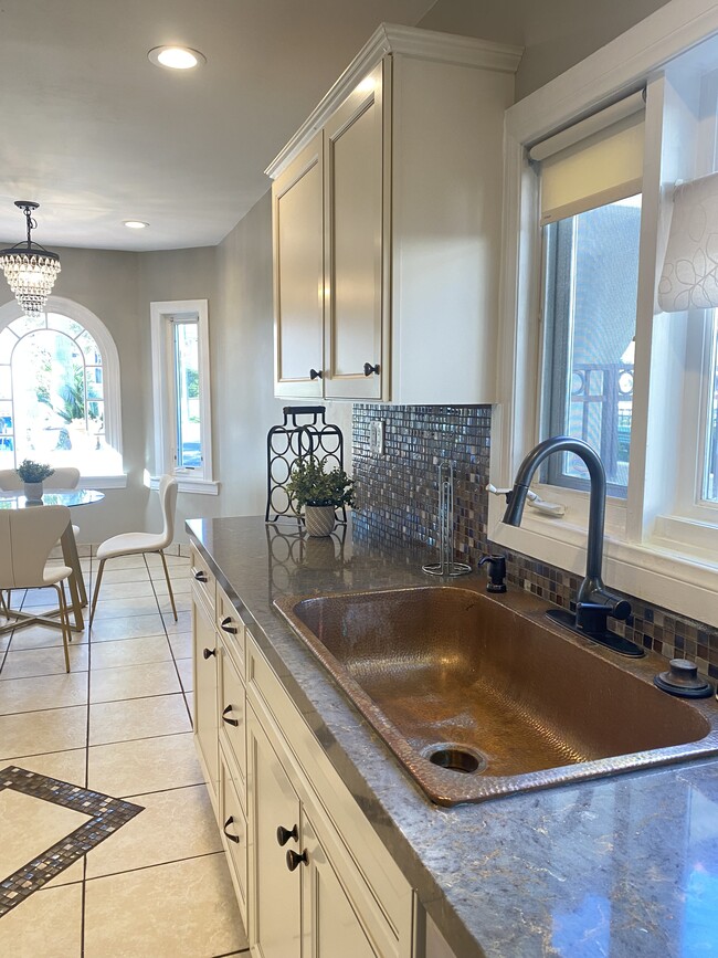 Kitchen with brass farm sink - 1350 Curson S Ave