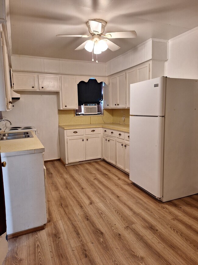kitchen with hardwood floors - 15010 County Road 1876