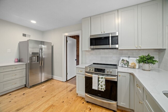 Building Photo - COMPLETELY RENOVATED 5BR/2.5BA with Office - North End Property with Garage