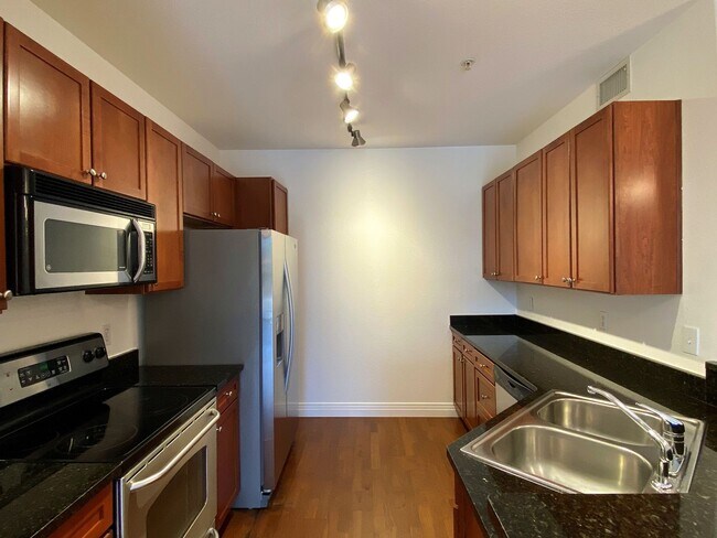 Building Photo - Stylish 1BD/1BA Condo with Garage & Balcony in Sought-After Englewood Location | $1,795/mo