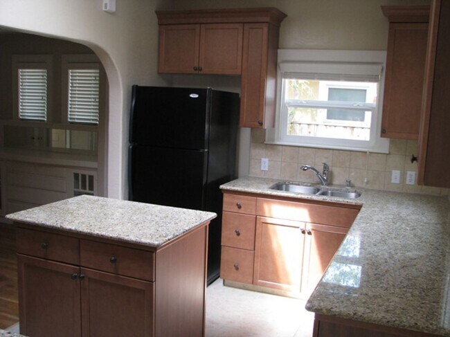 Building Photo - This Charming Spanish style home is locate...