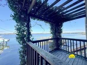 Building Photo - Waterfront Luxury Living on Garniers Bayou with Boat Slip/Lift Included!