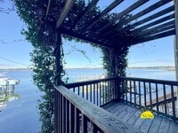 Building Photo - Waterfront Luxury Living on Garniers Bayou with Boat Slip/Lift Included!