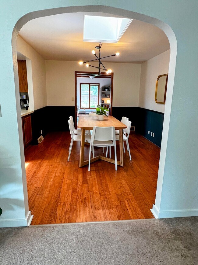 The dining room comfortably seats six and open into the kitchen, study, and living room. - 228 W Lexington Blvd