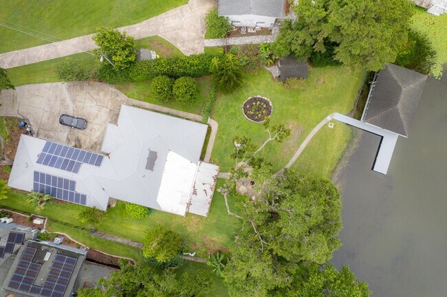 Building Photo - Lake Jessamine Luxury: Solar-Powered Waterfront Retreat on 1.14 Acres with Dock & Boathouse