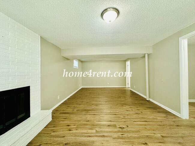 Building Photo - Updated Raytown Ranch w/ Wood Floors, SS Appliances, Finished Basement and a Fenced Yard!