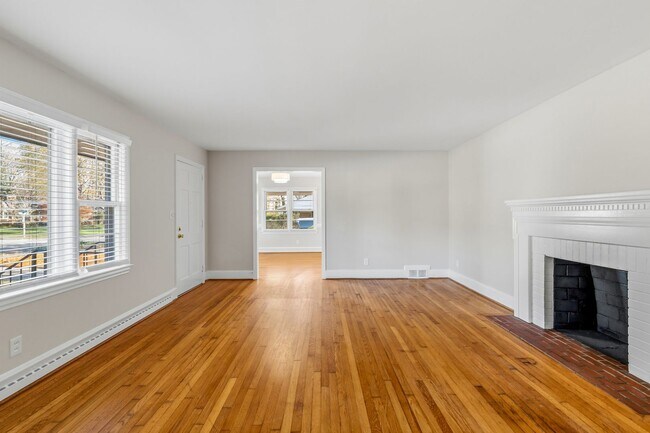 Building Photo - NW - Large Brick Ranch, Updated, Hardwoods, LR, DR, Den, Two Decorative Fire Places, Fenced, Stor...