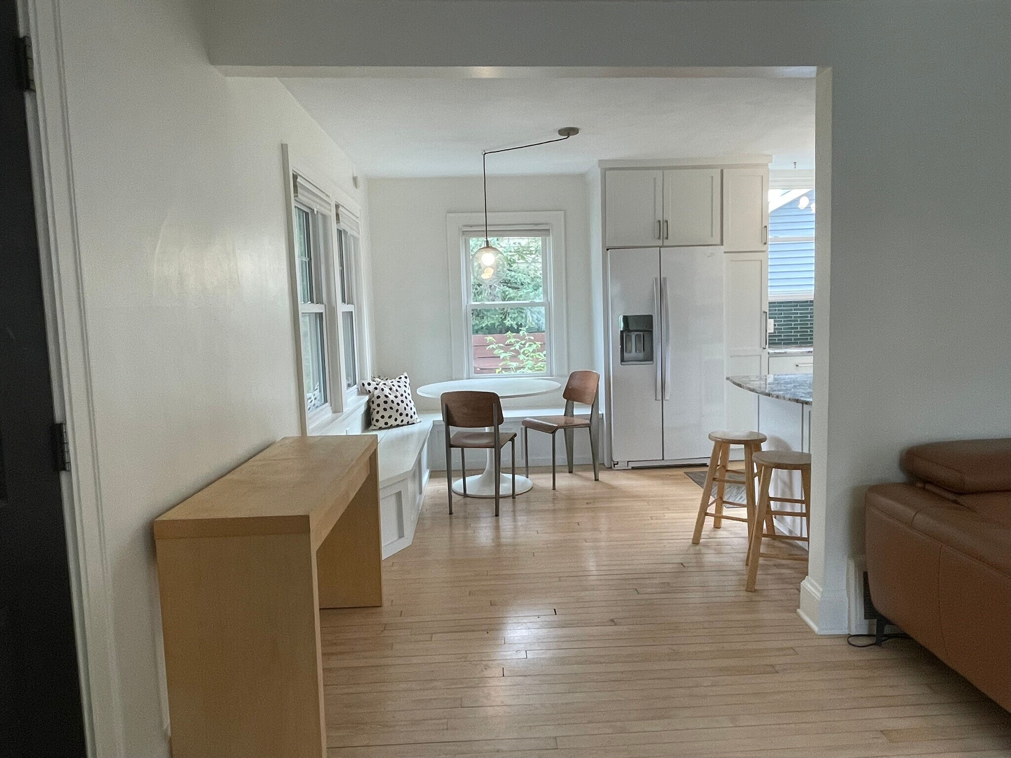 Spacious open layout with large windows and ceiling fan - 3209 Atwood Ave