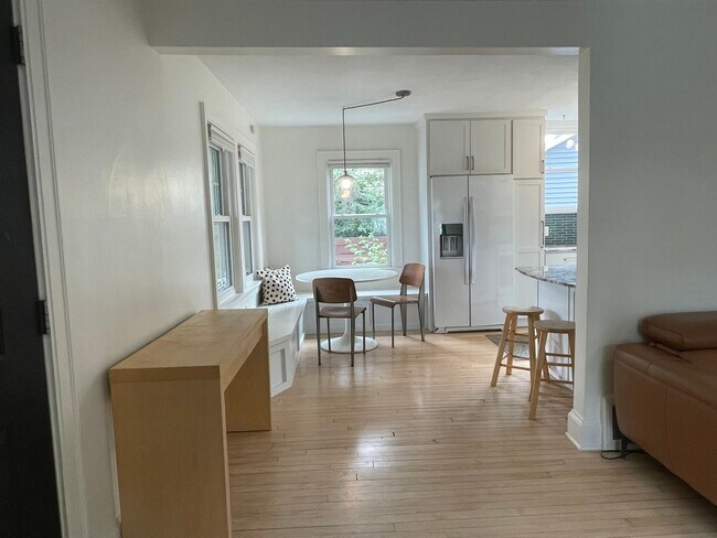 Spacious open layout with large windows and ceiling fan - 3209 Atwood Ave