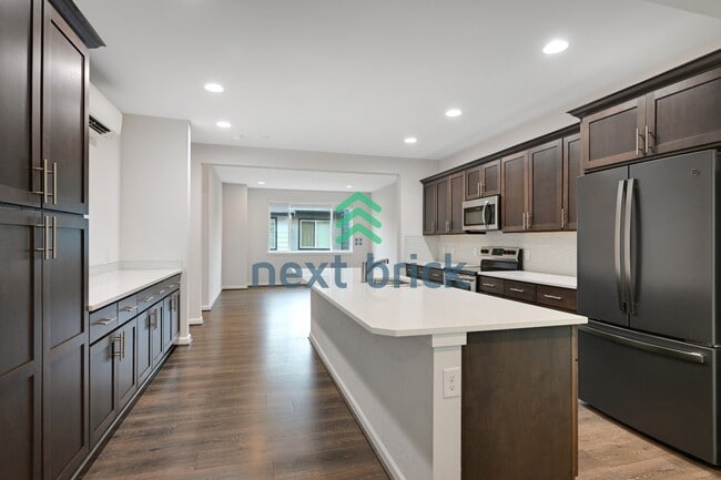 Building Photo - A Beautiful Corner Home Designed for Comfort, Light & Community!