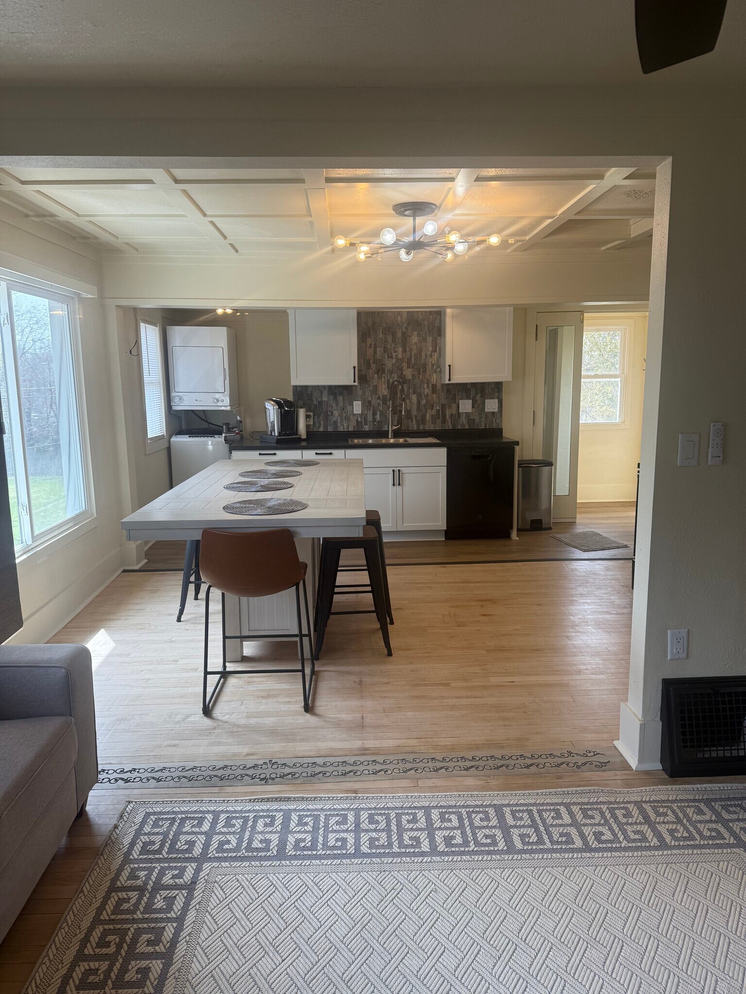 Dining area upstairs with view of kitchen, laundry area - 1540 N 10th St