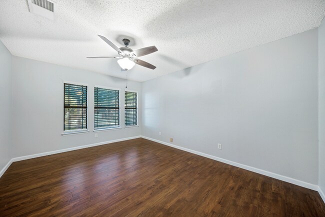 Building Photo - Sign your lease and receive a FREE 50" TV!!!  "Spacious 4-Bedroom Retreat with Fireplace in Charm...