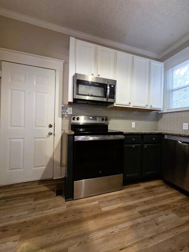 Building Photo - Renovated stately brick home in Forest Hill area on large lot.