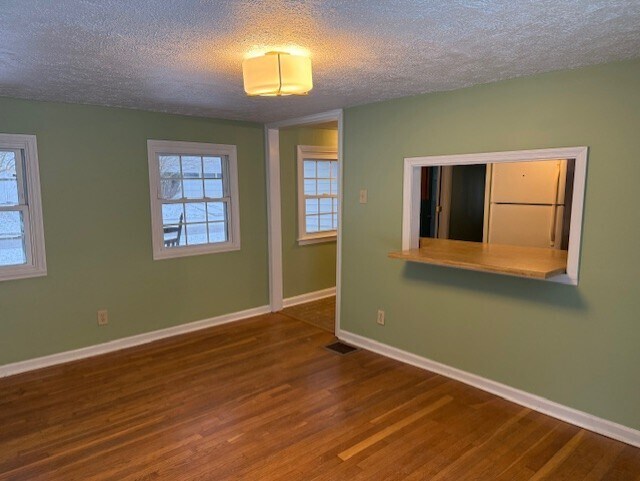View of dining room with passthrough to kitchen - 16 Leawood Ave