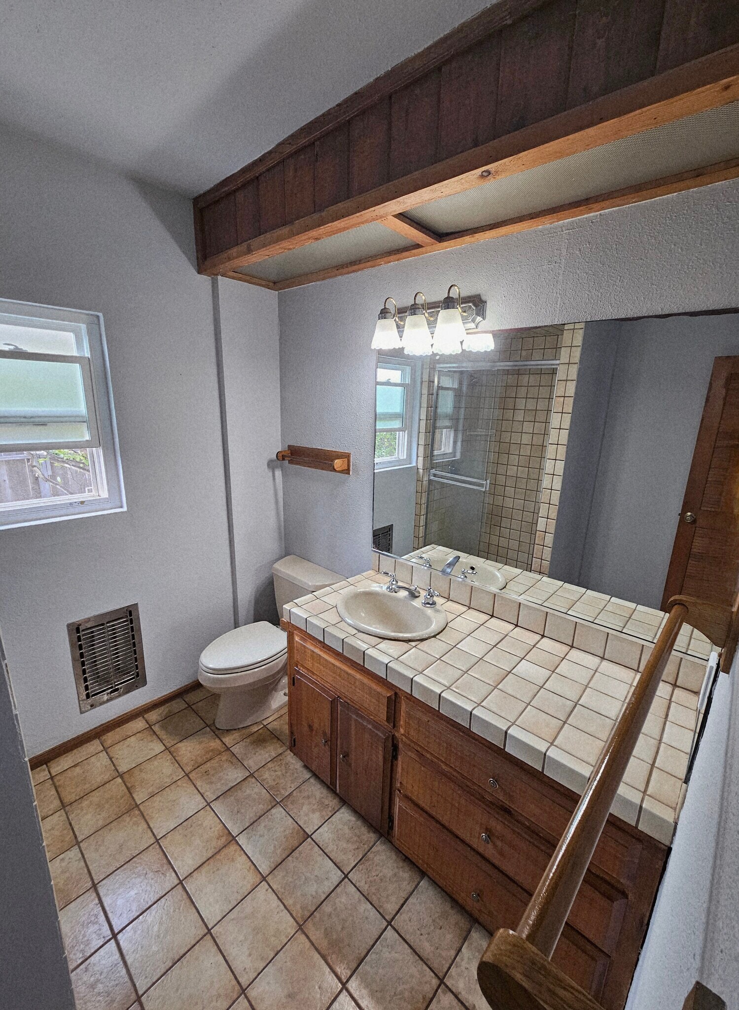 Natural wood vanity with Spanish Tile countertop & flooring. - 934 S Myers St
