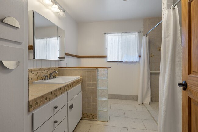 Bathroom with shower and separate tub - 228 N Pueblo Ave