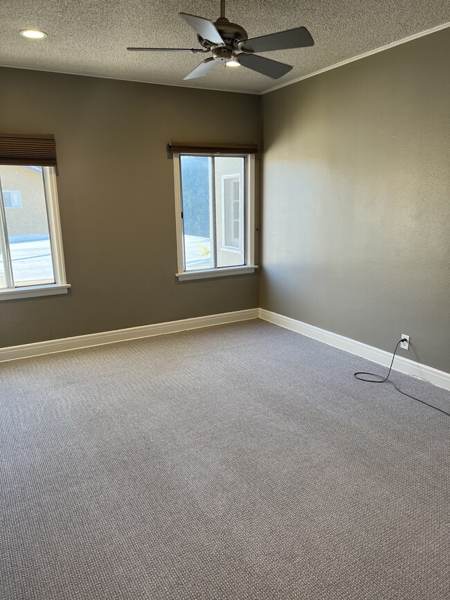 Bedroom number one, new carpet, ceiling fan - 1614 Cimarron St